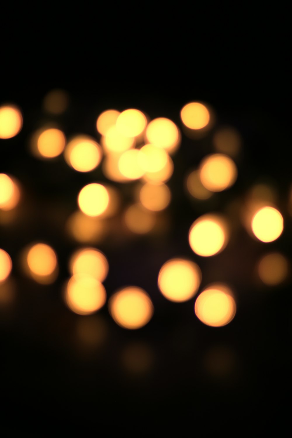 a group of lit candles sitting on top of a table