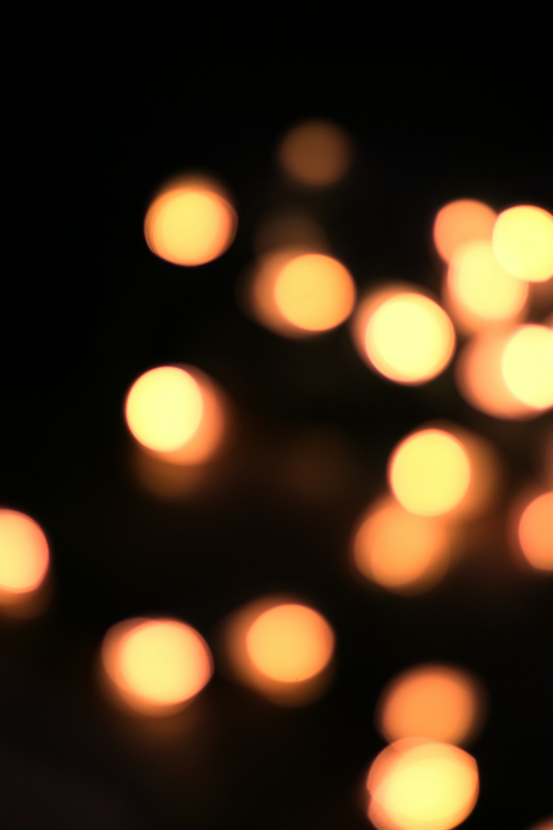 a group of lit candles sitting on top of a table