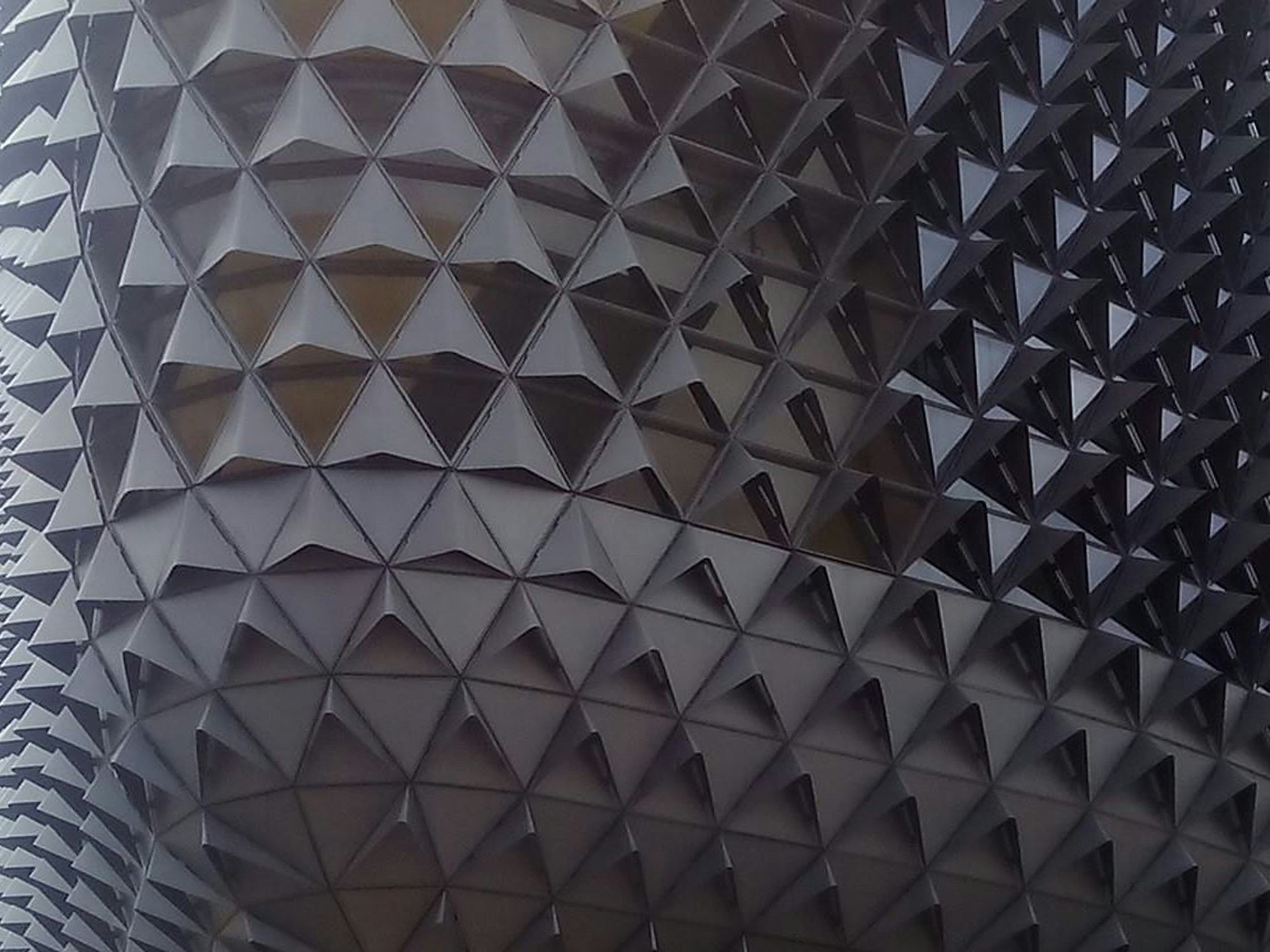 a close up of a building with a lot of triangles on it