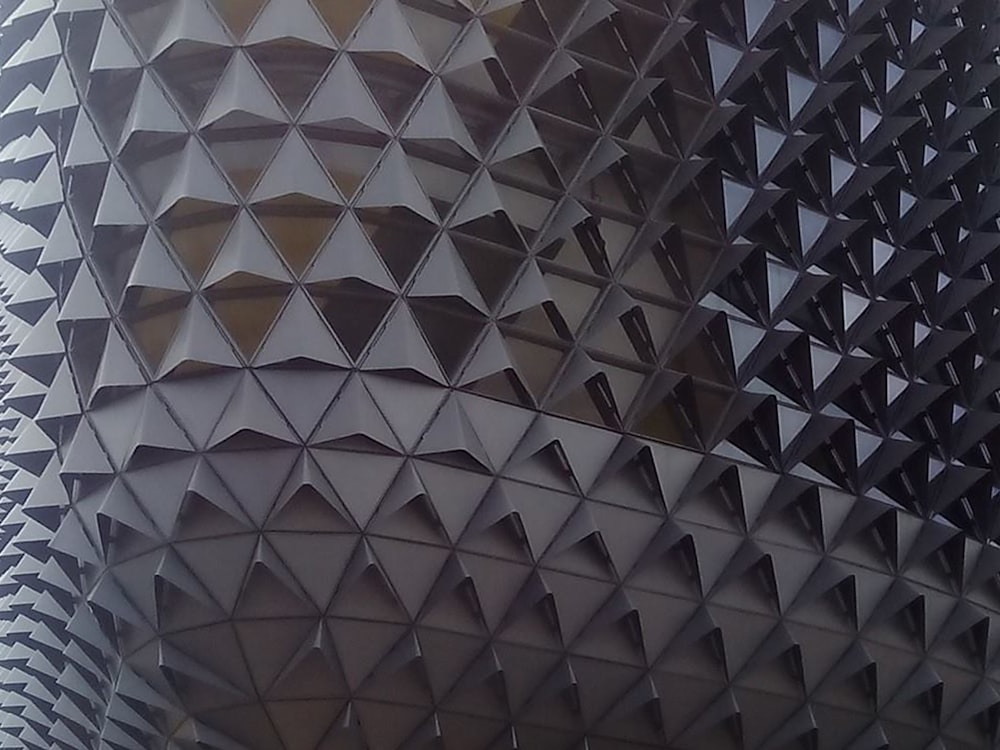 a close up of a building with a lot of triangles on it