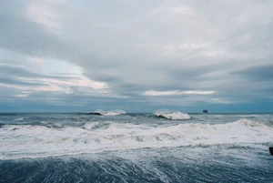 Ship at sea under a dark stormy sky