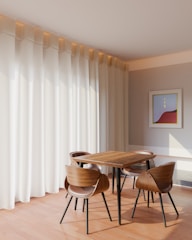 A stylish dining area with contemporary chairs and a wooden table.
