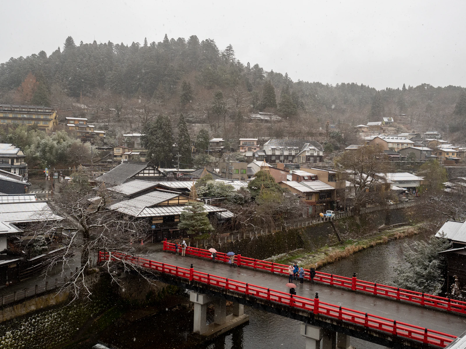 The red Nakabashi bridge over the Miyagawa river in Takayama