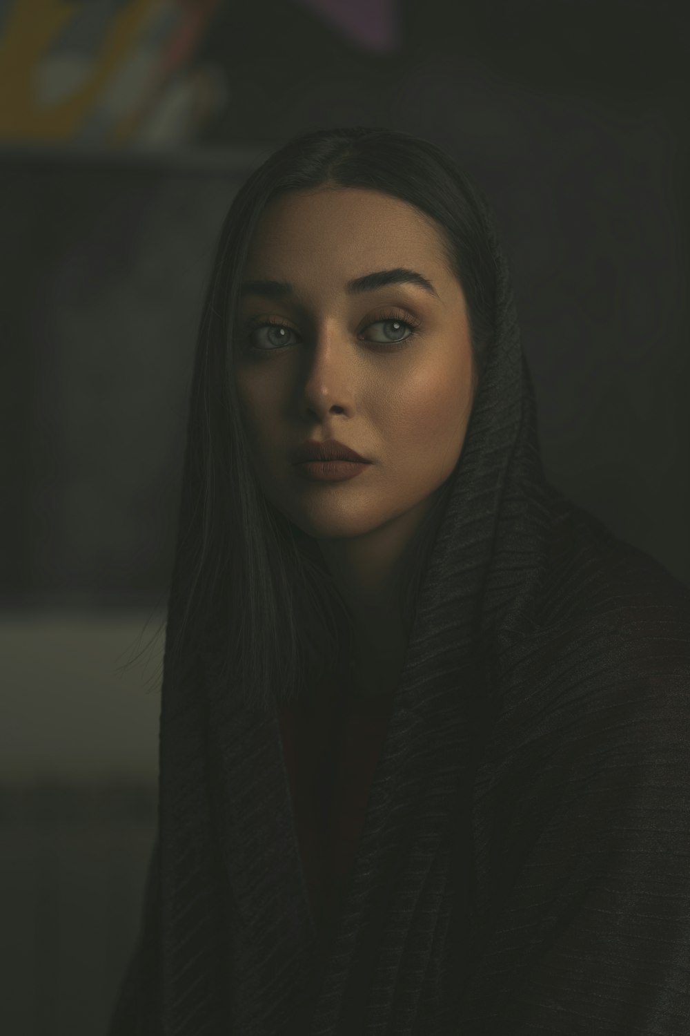 a woman with a black shawl on her head