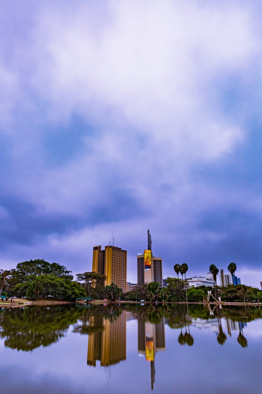 a large body of water with buildings in the background