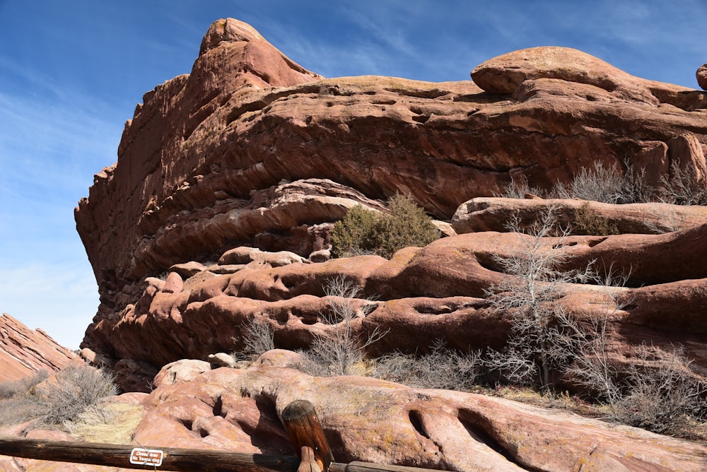 a large rock formation in the middle of a desert