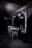 Outdoor patio featuring custom pergola and ambient lighting for evening use.