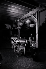 An elegant outdoor dining setup under a stylish pergola.