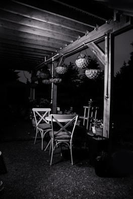 Outdoor patio featuring custom pergola and ambient lighting for evening use.