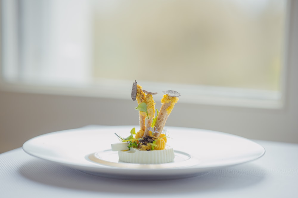 a white plate topped with food on top of a table