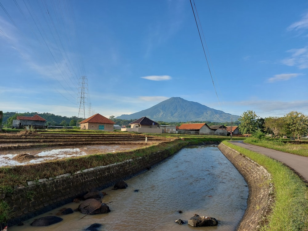 a river running through a lush green countryside