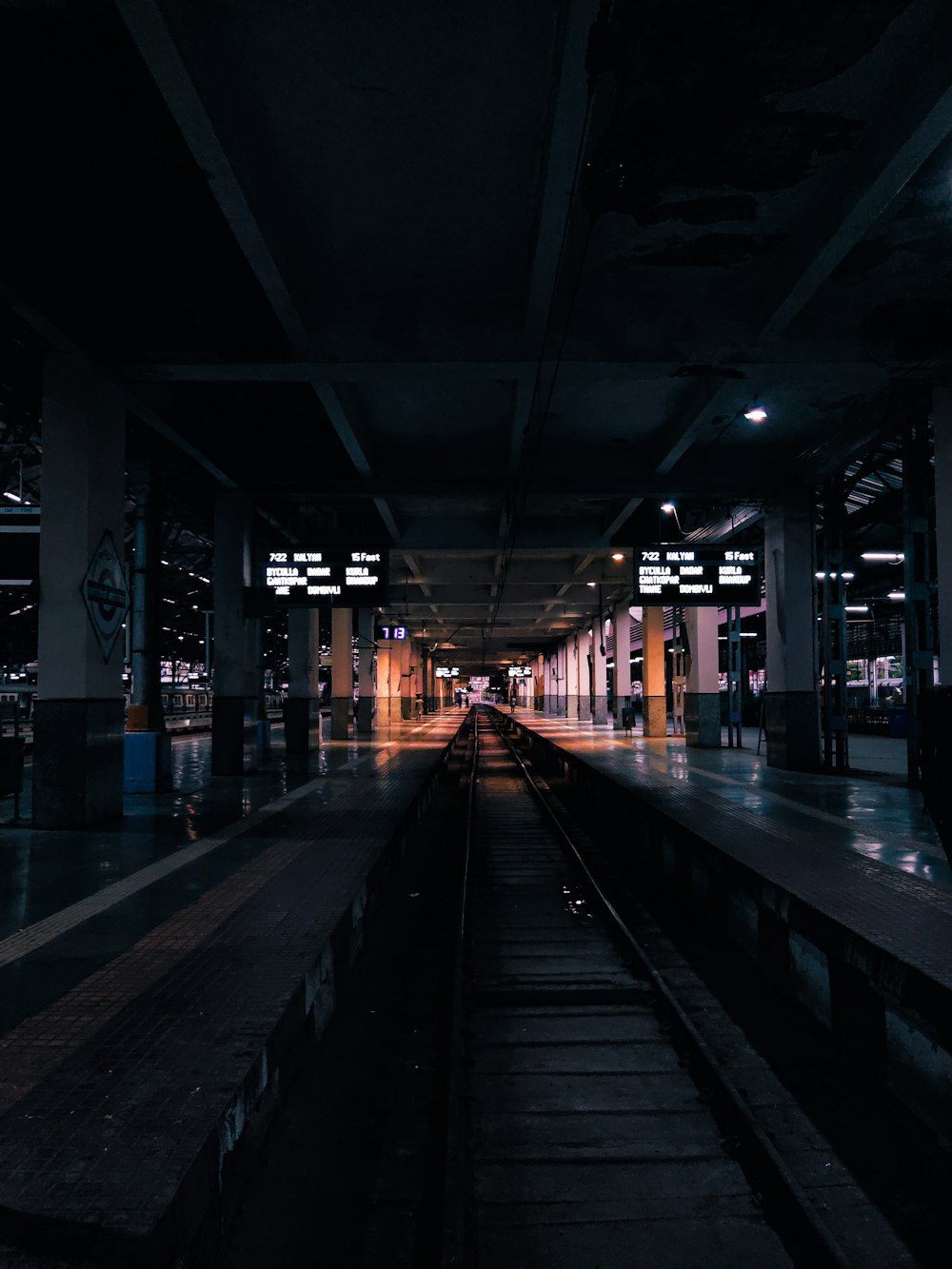 a train station with a train on the tracks