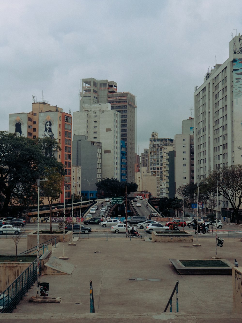 a parking lot in a city with tall buildings