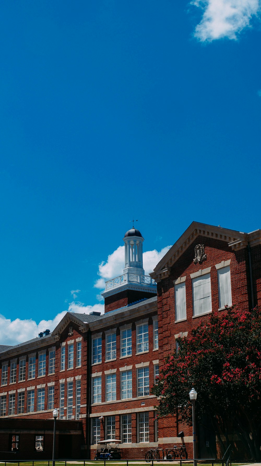 a large brick building with a clock tower on top