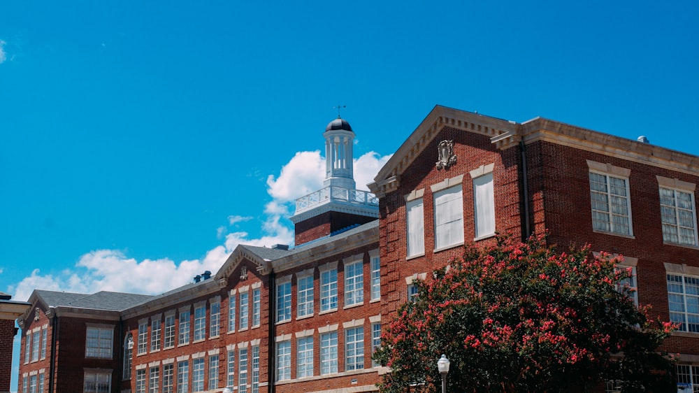 a tall brick building with a clock tower on top