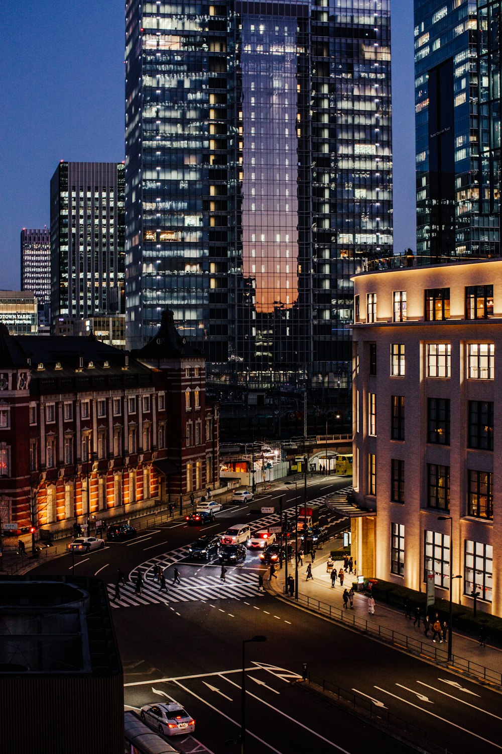 a city at night with a lot of tall buildings