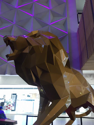 An intimate close-up of the lion-themed artwork displayed prominently in the hotel lobby.