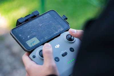 a close up of a person holding a game controller