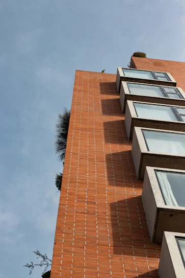 a tall brick building with lots of windows