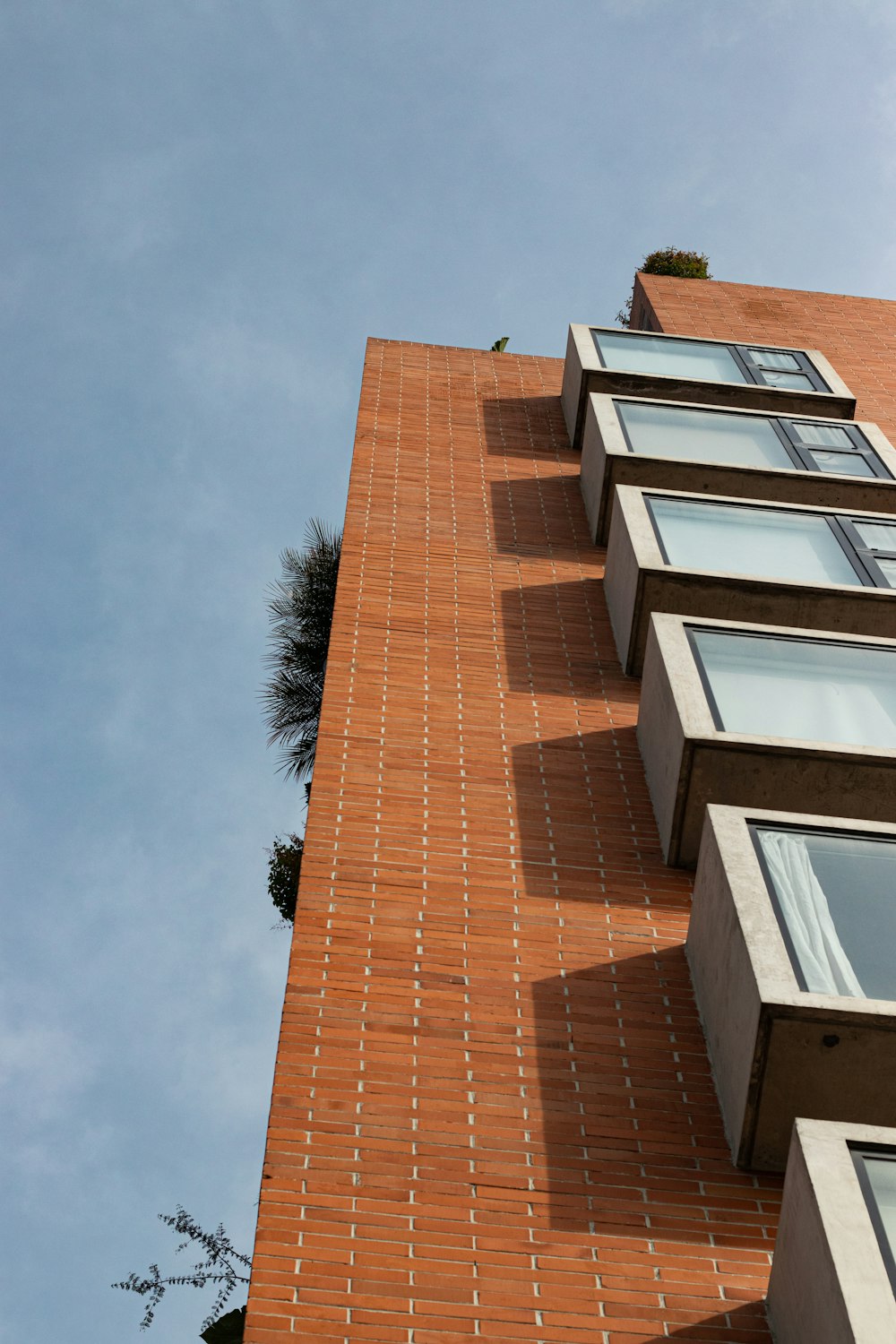 a tall brick building with lots of windows