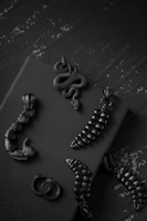 Handcrafted gothic-style jewelry with dark stones and antique metalwork