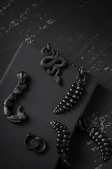 Handcrafted gothic-style jewelry with dark stones and antique metalwork