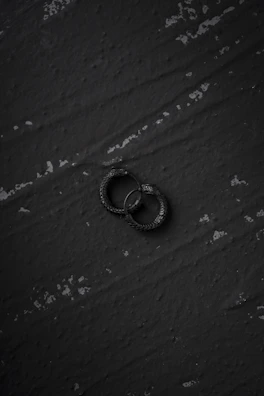 Handmade earrings featuring sharp geometric shapes and matte black finish.