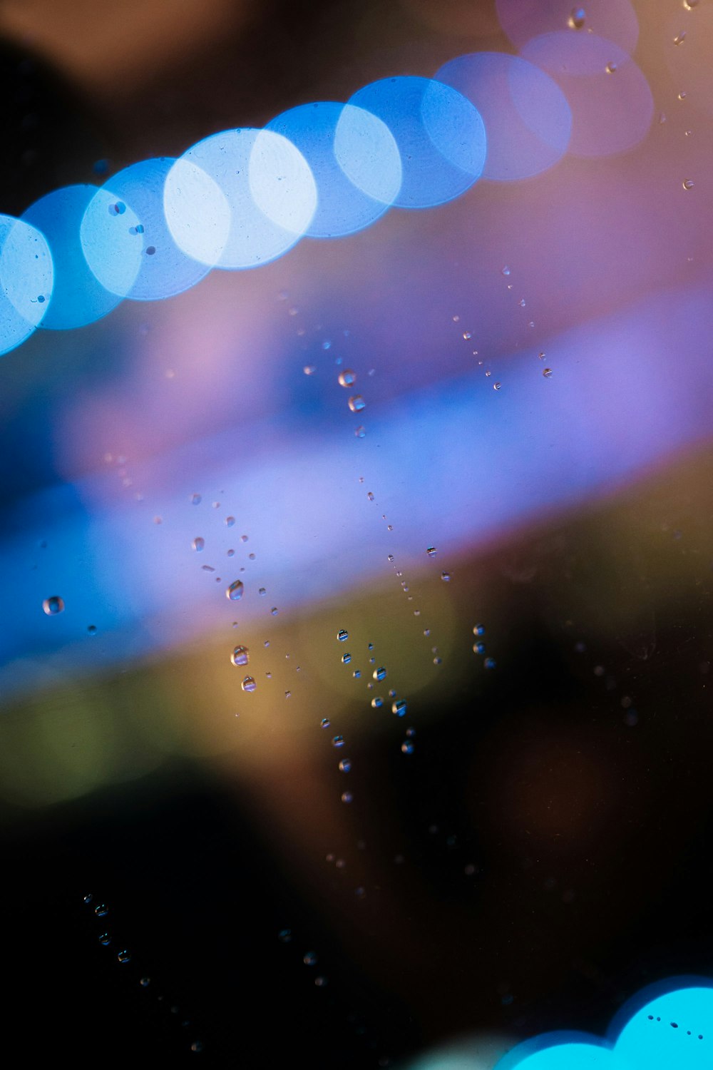 a close up of a window with raindrops on it