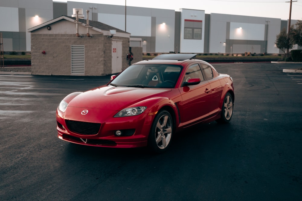 a red sports car parked in a parking lot