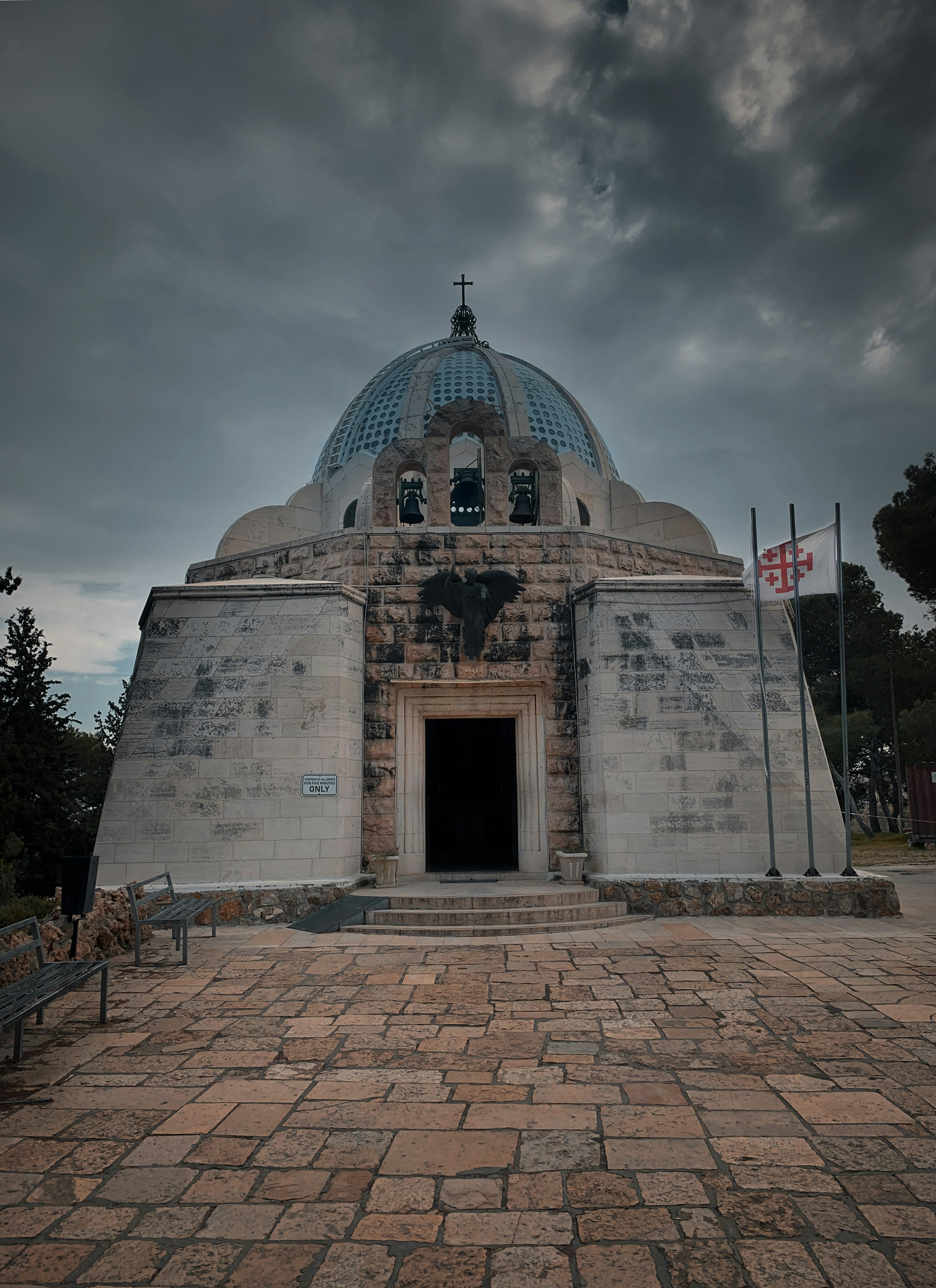 a stone building with a blue dome on top