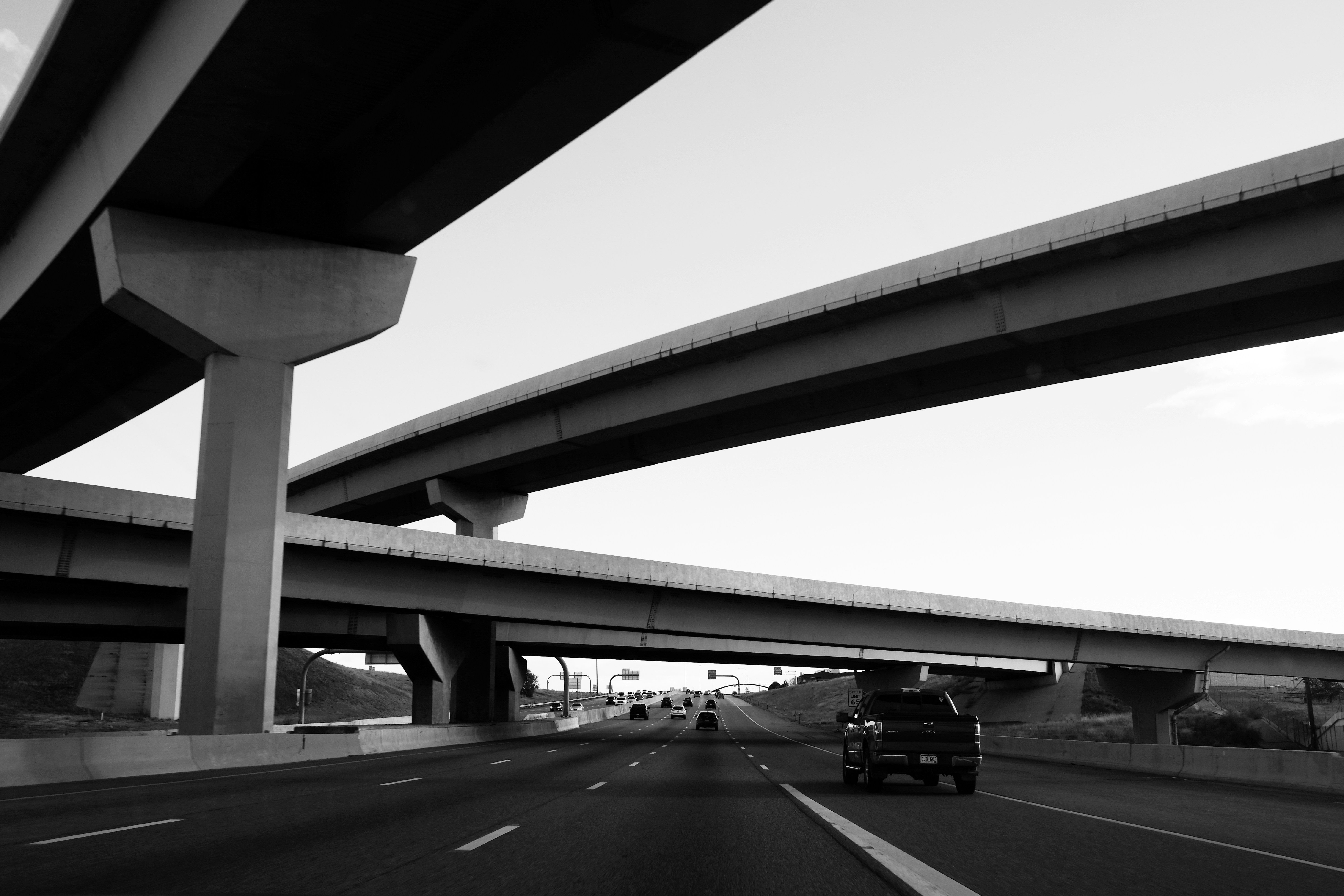 a black and white photo of a highway