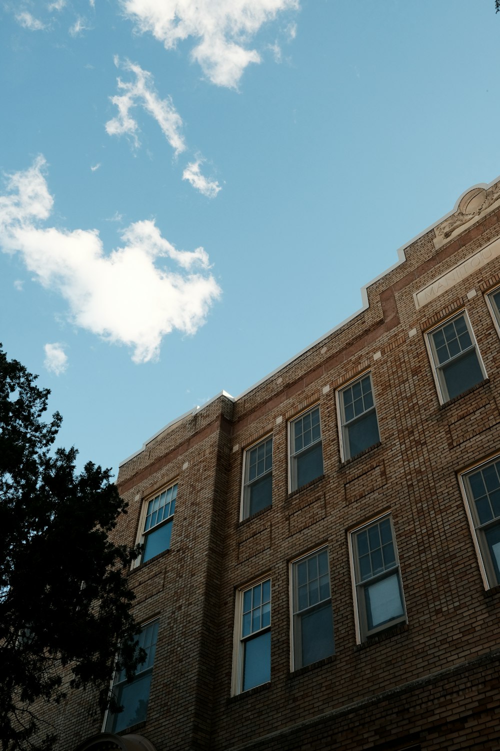 a tall brick building with lots of windows