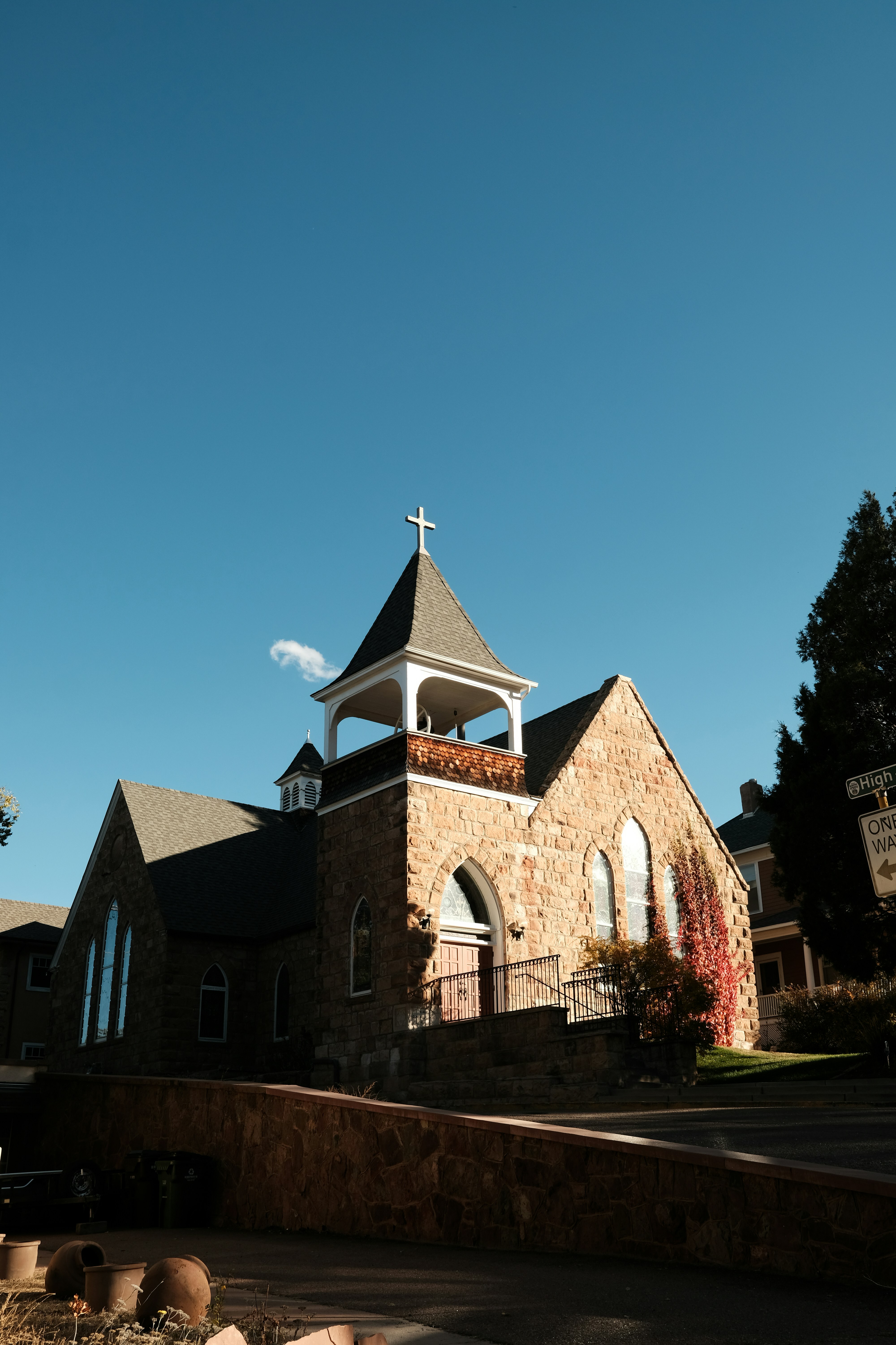 a church with a steeple and a cross on top