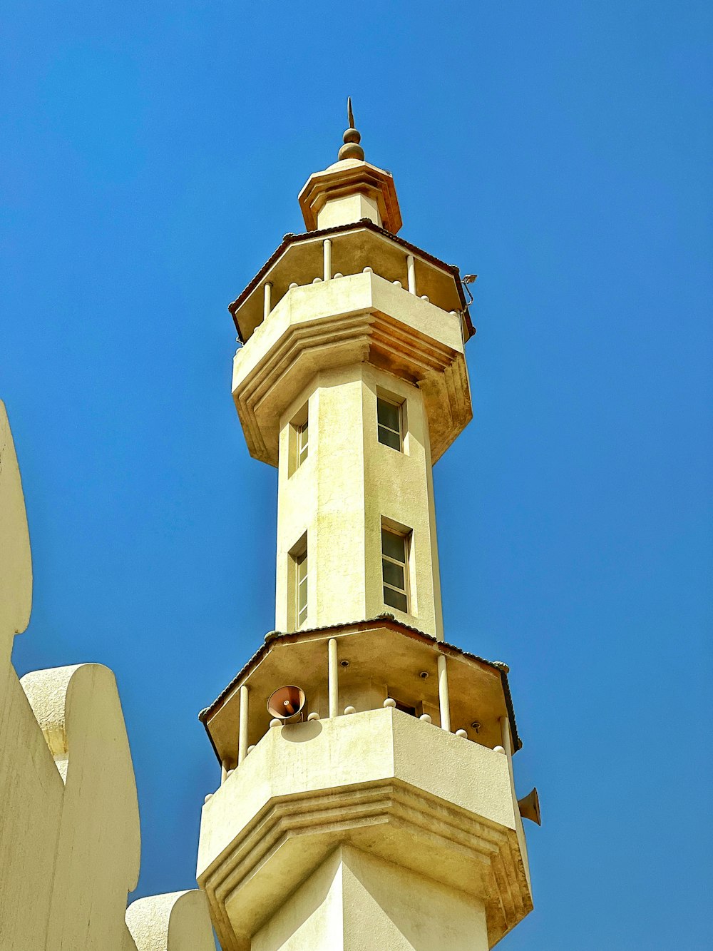 a tall tower with a clock on the top of it