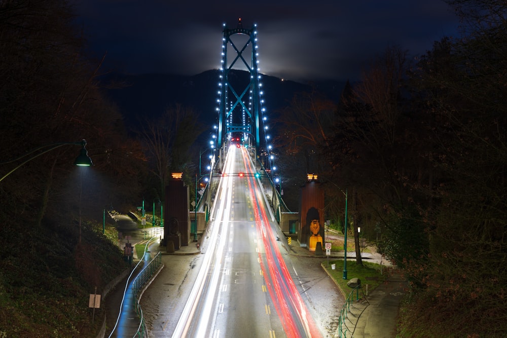 a long exposure shot of a bridge at night