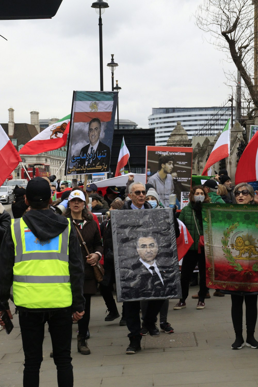 a group of people holding signs and flags