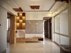 a living room with a large painting on the wall
