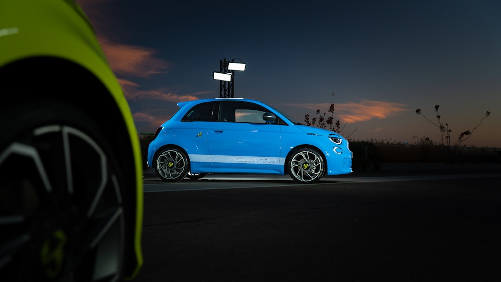 a blue car parked on the side of the road