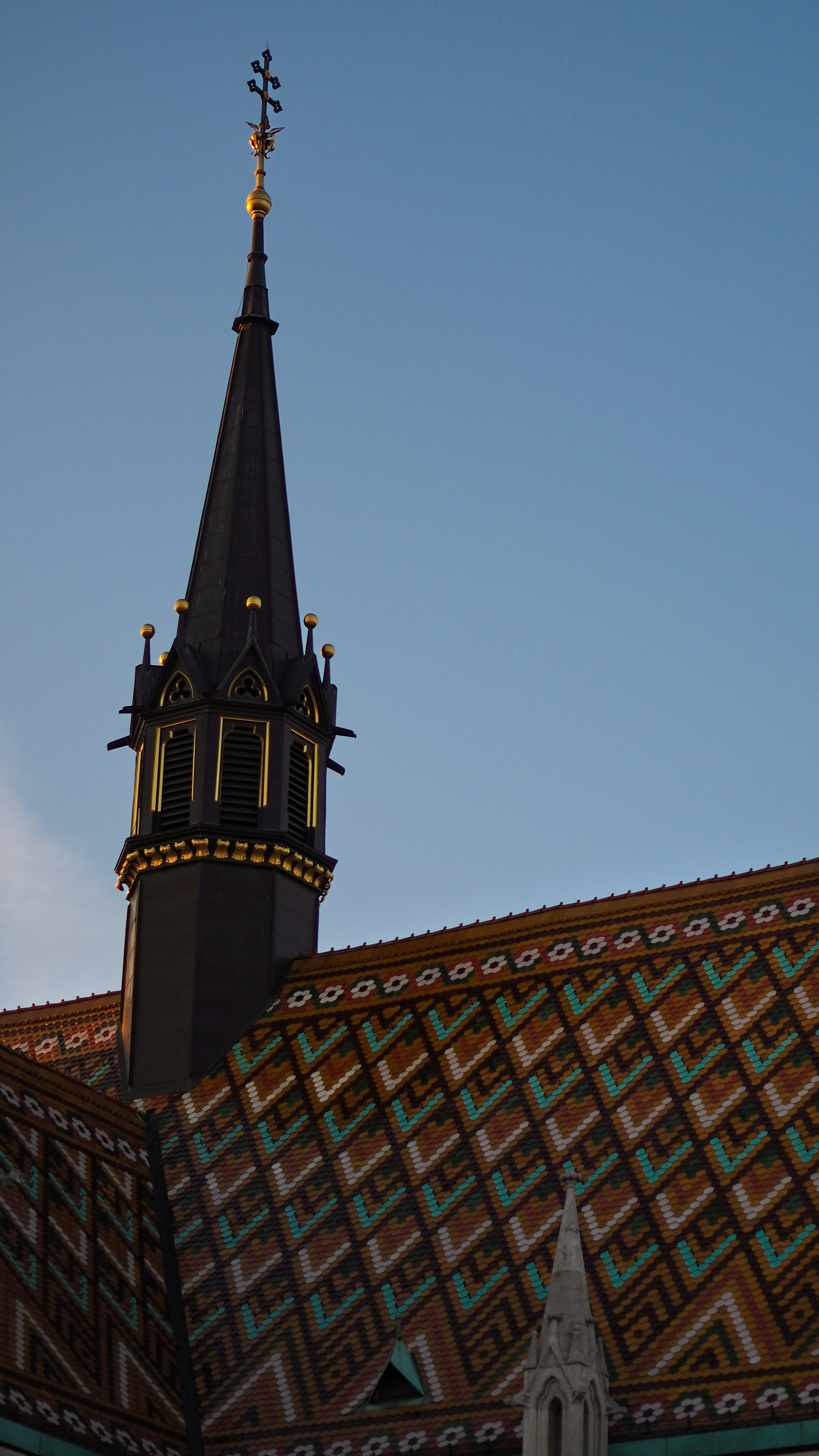 a building with a steeple with a clock on it