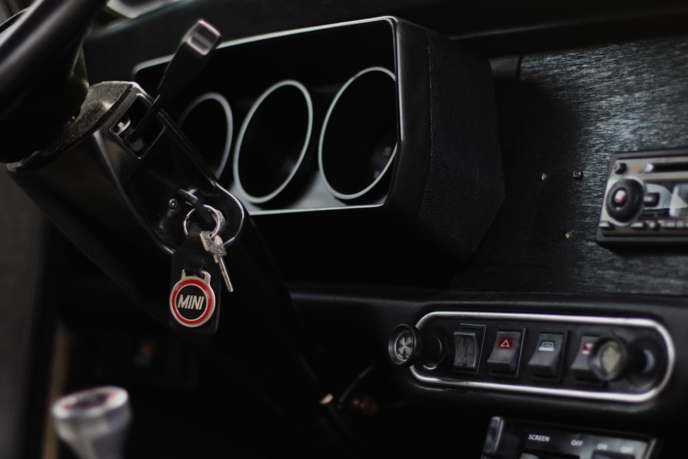 a close up of a car dashboard with a car key