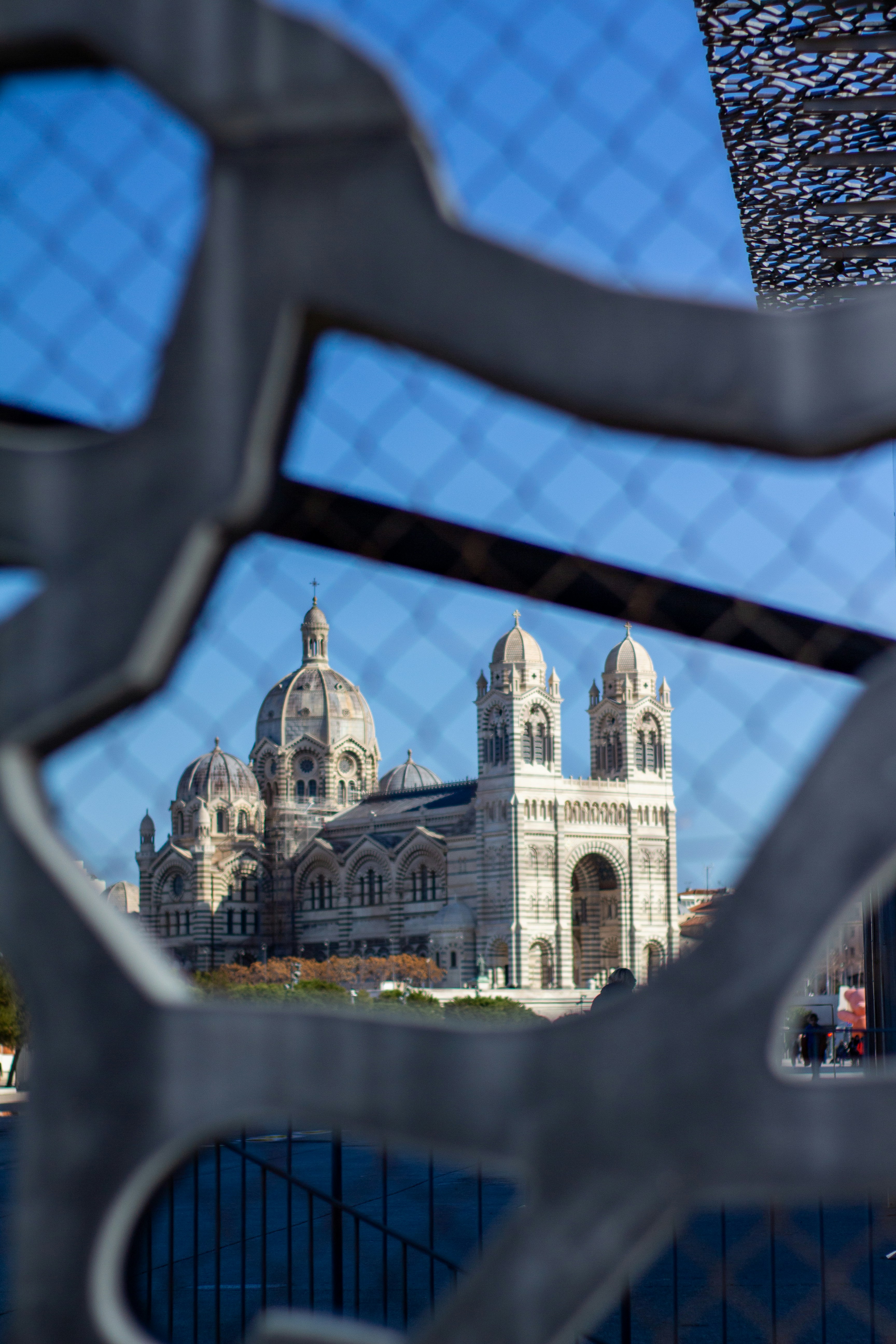 a view of a building through a fence