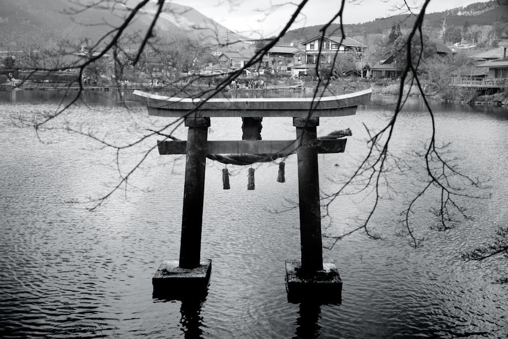 a large body of water with a bridge in the middle of it