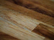 Close-up shot of textured wooden furniture surface highlighting craftsmanship details