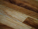 Close-up of handcrafted wooden furniture showcasing detailed textures and natural finishes.