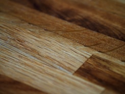 Detailed shot of wood surfaces restored and stained to highlight natural grain.