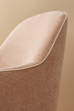 Close-up image showing the difference between a cleaned and a dirty upholstered chair.