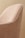 A close-up view of a fabric-covered chair with a textured pattern in shades of beige. The chair features white piping along the edges, creating a clean and elegant outline.