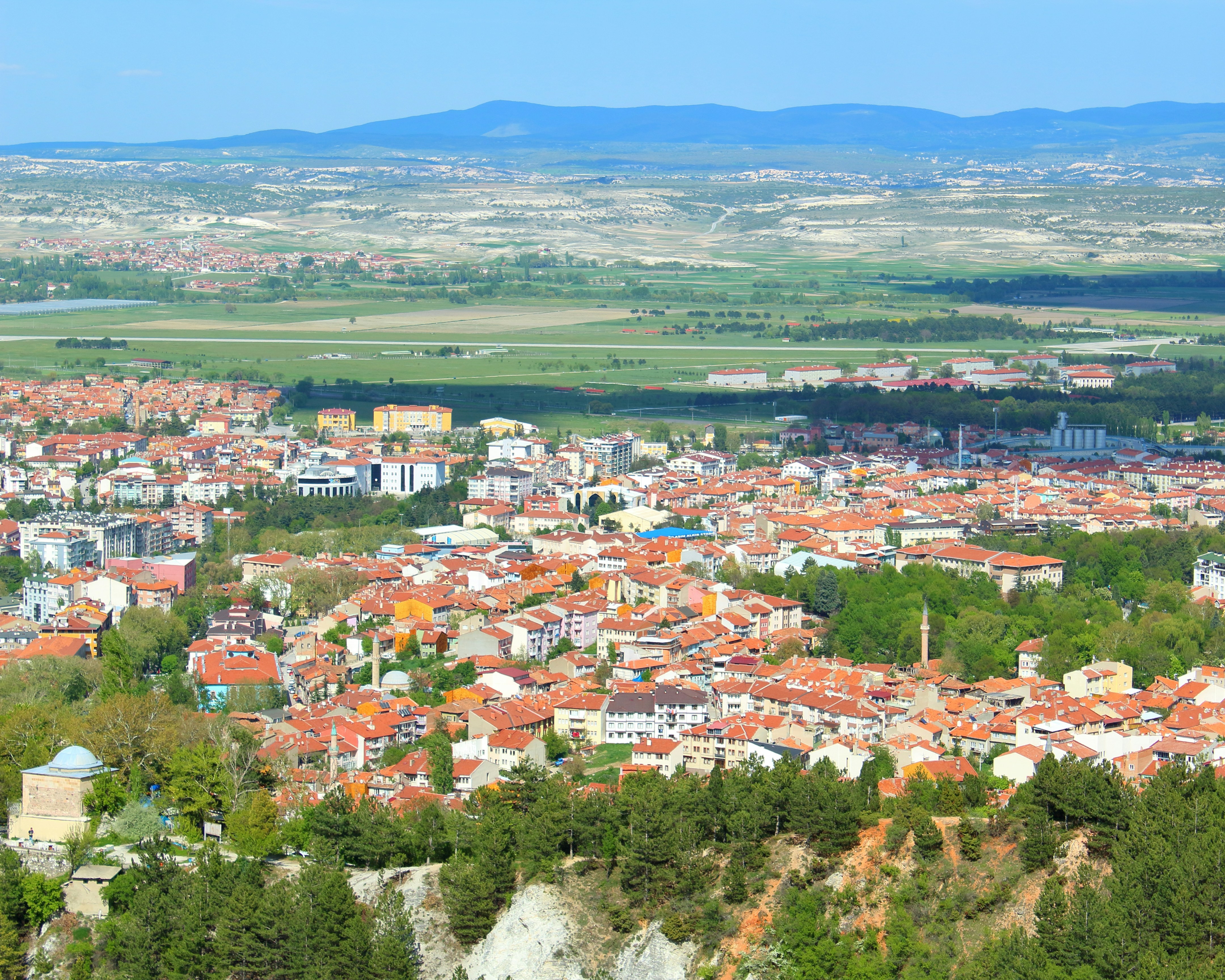 a view of a city from the top of a hill