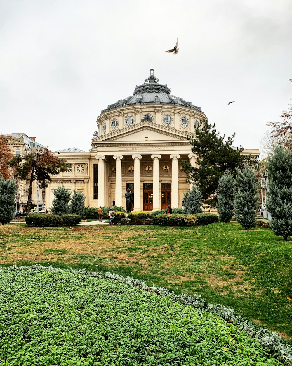 a large building with columns and a dome