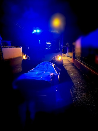 Paramedics attending to a patient in an ambulance at dusk in Ethekwini.